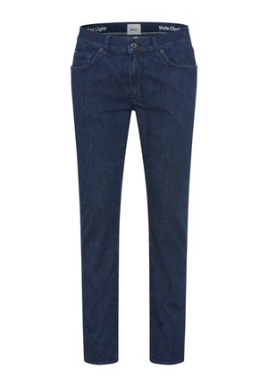 Donkerblauwe slim-fit jeans met voorste knoop en ritssluiting, ontwerp met vijf zakken, en een merkbare tailleband zichtbaar aan de binnenkant.