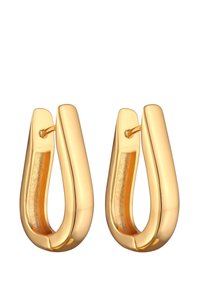 Goldene Creolen mit einer glatten, glänzenden Oberfläche; U-förmiges Design; hohler Innenraum; minimalistische Hardware-Akzentuierung.