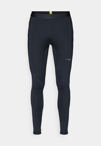 Navy athletic leggings made of stretch fabric, featuring a smooth waistband, slim fit, and reflective logo on the side.