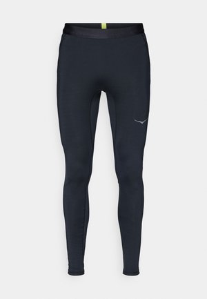 Marineblaue Sportleggings aus dehnbarem Material, mit einem glatten Bund, schlankem Schnitt und reflektierendem Logo an der Seite.