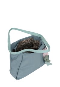 Borsa in tessuto blu morbido con una lunga tracolla, con un interno a pois, molteplici scomparti e un dettaglio decorativo a nodo sui lati.