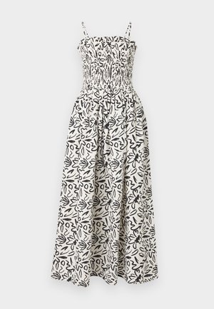 Maxi dress with black and white abstract floral print, smocked fitted bodice, and thin shoulder straps.