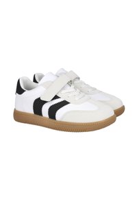 Zapatillas bajas blancas y negras con suelas beige, cordones frontales y una única tira de velcro en la parte superior.