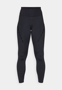 Musta korkeavyötäröinen leggingit, joissa on leikattuja yksityiskohtia sivuilla, valmistettu joustavasta kankaasta, jolla on sileä tekstuuri ja tiukka muotoilu.