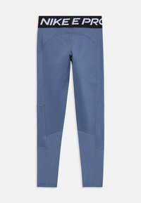 Leggings Nike Pro en bleu avec une taille noire. Les caractéristiques incluent des coutures à plat et des panneaux texturés pour un soutien et une flexibilité supplémentaires.