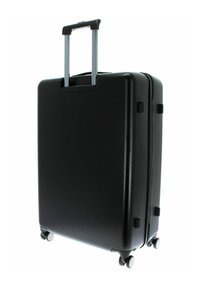 Valise rigide noire avec une poignée en aluminium télescopique, quatre roues et des bords arrondis, dotée d'une surface lisse et texturée.