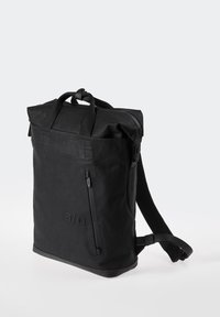 Black rectangular backpack with top handles, a front vertical zip pocket, adjustable padded shoulder straps, and a subtle embossed logo.