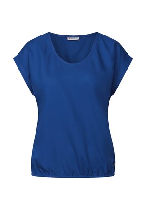 Camiseta de manga corta y cuello redondo en un vibrante azul, confeccionada en una tela suave. Presenta un dobladillo elástico y un sutil detalle del logo en el lado inferior.