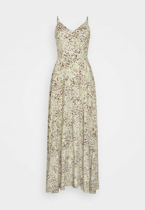 Maxi-jurk van lichtgroene stof, met een bloemenpatroon in paars en wit, met dunne spaghettibanden en een aansluitende stof die overgaat in een uitlopende rok.