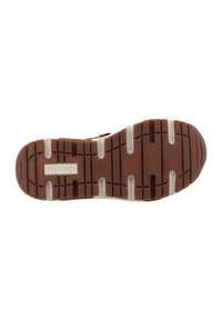 Suela de zapato de goma negra con un diseño de tracción, con un talón marrón y acentos de mediopié blancos. Logo presente en la superficie.