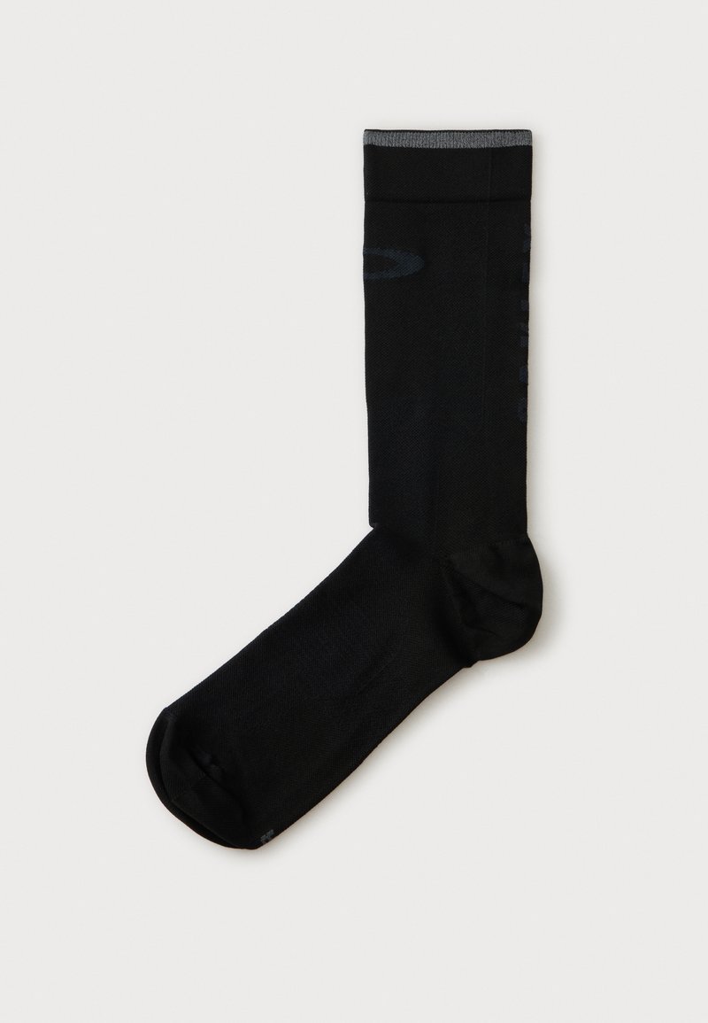 Chaussette noire crew unique avec bord de manchette gris, affichée à plat sur un fond blanc uni.
