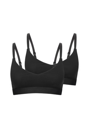 Zwei schwarze, kabellose BHs mit verstellbaren dünnen Schulterträgern und elastischen Unterbändern vor weißem Hintergrund.