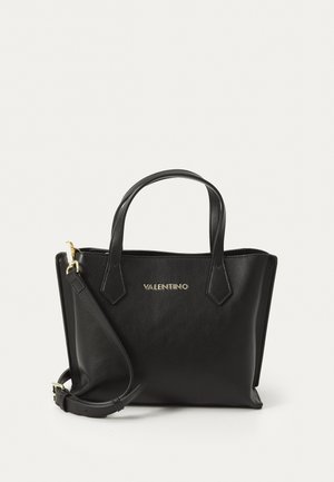 Black leather tote bag with two short handles and a detachable shoulder strap. Features gold-tone branding on the front and sharp corners.