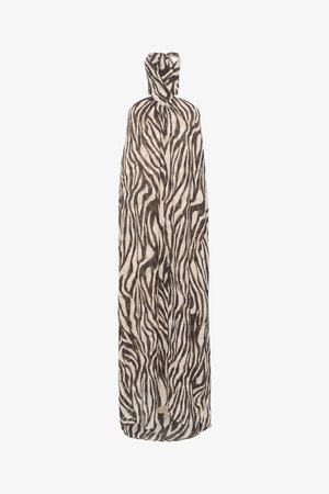 Zebra print cape made of lightweight fabric; features a flowing design with a hood, predominantly beige with black stripes.