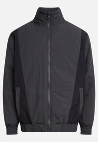 Black windbreaker jacket featuring a high collar, zip front, elastic cuffs, and two side pockets with contrasting dark panels.