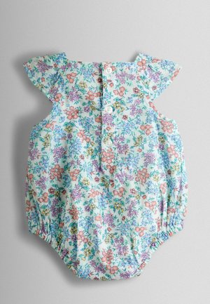 Õhuke sinise puuvillase kangaga lillemotiiviga kombinesoon, millel on volangidega varrukad, nööpidega kinnitamine ja kummiga vöökoht. Omaduseks on mitmevärviline lillemuster.