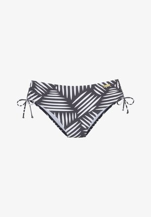 Braguitas de bikini en blanco y negro con estampado de hojas de palma y cordones laterales contra un fondo blanco.