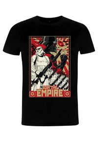 Black t-shirt featuring a graphic design of Stormtroopers and Darth Vader, with red, beige, and black accents, and "Join the Empire" text.