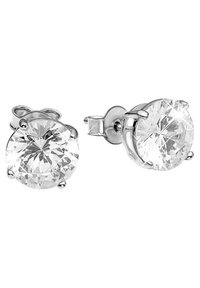 Boucles d'oreilles en forme de disque rond avec des pierres en cristal clair et facettées, montées sur des griffes en métal argenté, mettant en valeur un éclat et une clarté remarquables.