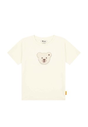 Cream cotton t-shirt featuring a plush bear face appliqué on the front. Short sleeves and a tag at the hem. Smooth texture.