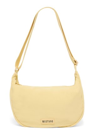 Light yellow shoulder bag with adjustable strap and small rectangular "MUSTANG" logo patch on front center.