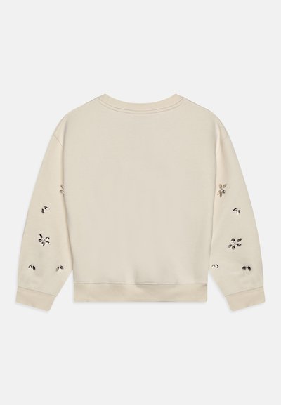 Sudadera color crema con un corte relajado, que presenta patrones florales bordados en las mangas y puños y dobladillo de canalé.