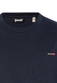 Marineblauwe T-shirt met korte mouwen van katoen, met een ronde hals, een voorzak en een klein geborduurd logo op de borst.