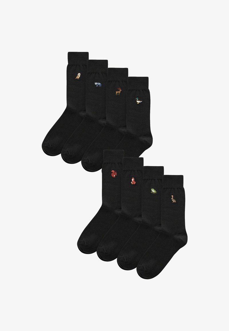 Schwarze Socken mit gestickten Tiermotiven: eine Eule, ein Fisch, ein Reh, eine Ente, ein Eichhörnchen, ein Fuchs, ein Frosch und ein Kaninchen in zwei Reihen.