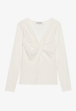 Fehér, hosszú ujjú felső V-nyakkal és elforgatott részletekkel elöl, sima, rugalmas anyagból készült, mely testhezálló megjelenést biztosít.