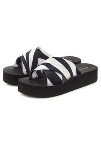 Striped fabric slide sandals featuring a black platform sole. The upper features white and navy stripes in a cross design.