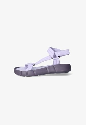 Sandal in viola da esterno con suola testurizzata e flessibile. Presenta cinturini imbottiti e un design sicuro per la caviglia. Forma leggera e minimalista.