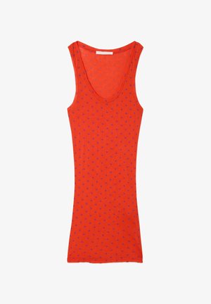 Red tank top with a deep neckline and purple polka dots. Made of lightweight fabric, featuring a fitted silhouette and no sleeves.
