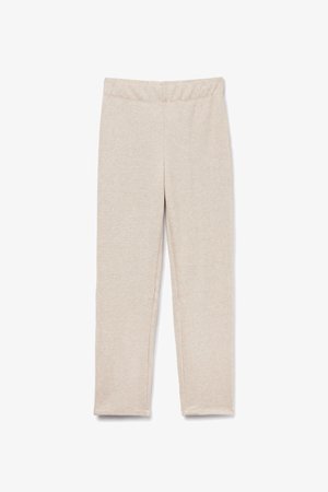 Leggings de color beige claro fabricados con una tela suave y elástica. Presentan una cinturilla ancha de elastano y costados sin costuras para mayor comodidad.