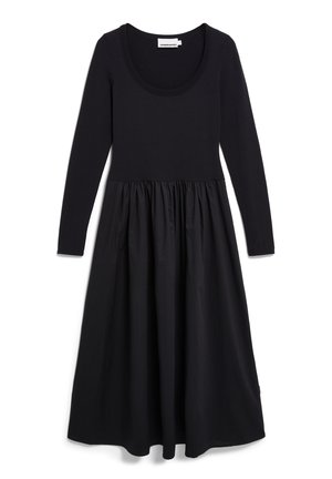 Black dress with a scoop neckline and long sleeves; fitted bodice with a gathered skirt; made from a smooth, lightweight fabric.