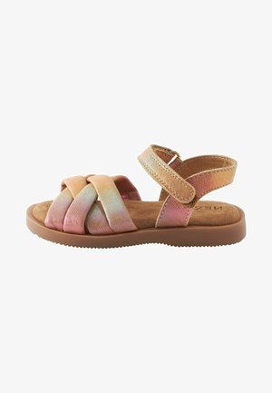 Child's sandal with a padded brown sole, featuring crisscross pink and gold straps. Adjustable ankle strap with a metallic buckle.