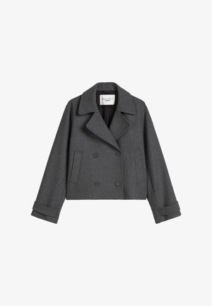 Gray wool double-breasted jacket with a wide collar, two front pockets, and rolled cuffs. Smooth texture and tailored fit.