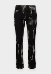 Svarta denimjeans med en bleknad blekeffekt, rak benmodell, fem fickor och en märkespärm på midjan.