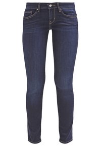 Jean skinny en denim bleu foncé avec taille mi-haute, cinq poches et détails de couture contrastants. Texture lisse et coupe ajustée.