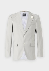  Lichtgrijze blazer met pieklapels, sluiting met twee knopen, zijzakken en een decoratieve witte bloemenaccent op de kraag. Gevoerd interieur.