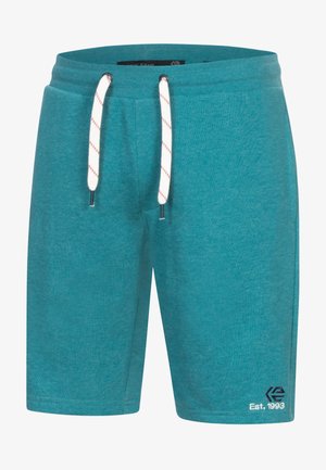 Pantaloni scurți din bumbac de culoare turcoaz, cu un osl pentru talie. Prezintă sfori albe cu accente roșii și broderie logo pe tivul inferior.