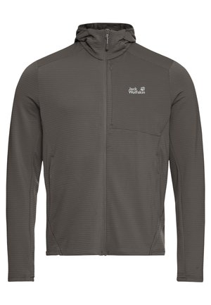 Grijze ritsjas met een gestructureerde afwerking, hoge kraag en een borstzak. Heeft een logo aan de bovenkant links en aansluitende mouwen.