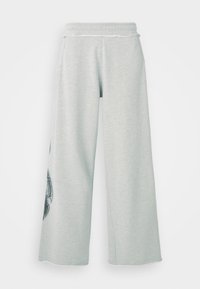 Light grey wide-leg sweatpants made from soft cotton blend, featuring side pockets and a decorative black graphic on the left leg.