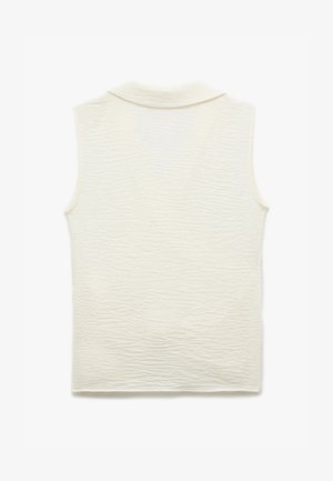 Hihaton kerma värinen toppi, jossa on teksturoitu, aaltonen kuvio ja kauluspaita-tyylinen kaulus. Kangas vaikuttaa kevyeltä ja hieman läpikuultavalta.