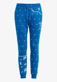 Niebieskie dresy bawełniane z regulowanym sznurkiem w talii, ozdobione wzorem paisley i logo z przodu. Regularny krój z ściągaczami na nogawkach.