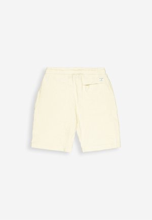 Lichtgele katoenen shorts met een gestructureerde afwerking, elastische tailleband en een enkele achterzak. Eenvoudig ontwerp, tot halverwege de dijen.