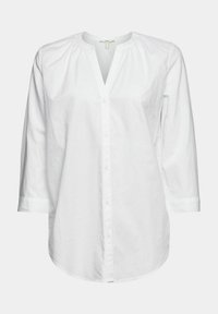 Chemise blanche à boutons avec manches trois-quarts, dotée d'un col, de fronces aux épaules et d'un ourlet arrondi. En coton.