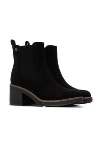 Stivaletti neri alla caviglia con finitura in suede, pannelli laterali elastici, tacco a blocco e dettagli di cucitura lungo la suola. Fascette piatte sul retro.