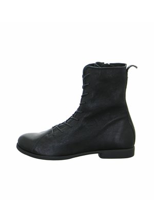 Black leather ankle boot with a textured finish, lace-up design, rounded toe, flat sole, and a small pull tab at the back.