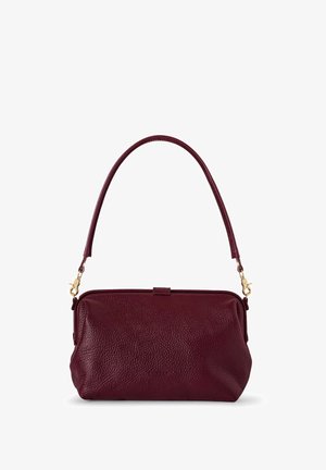 Burgundy leather handbag with a textured surface, a short handle, and gold hardware accents. Features a zip closure and rounded shape.
