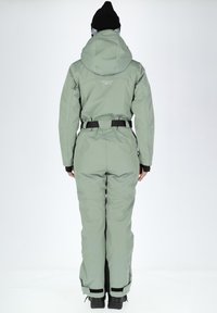 Green waterproof one-piece suit with a hood, waist belt, and black accents. Features adjustable cuffs and seamless design for mobility.